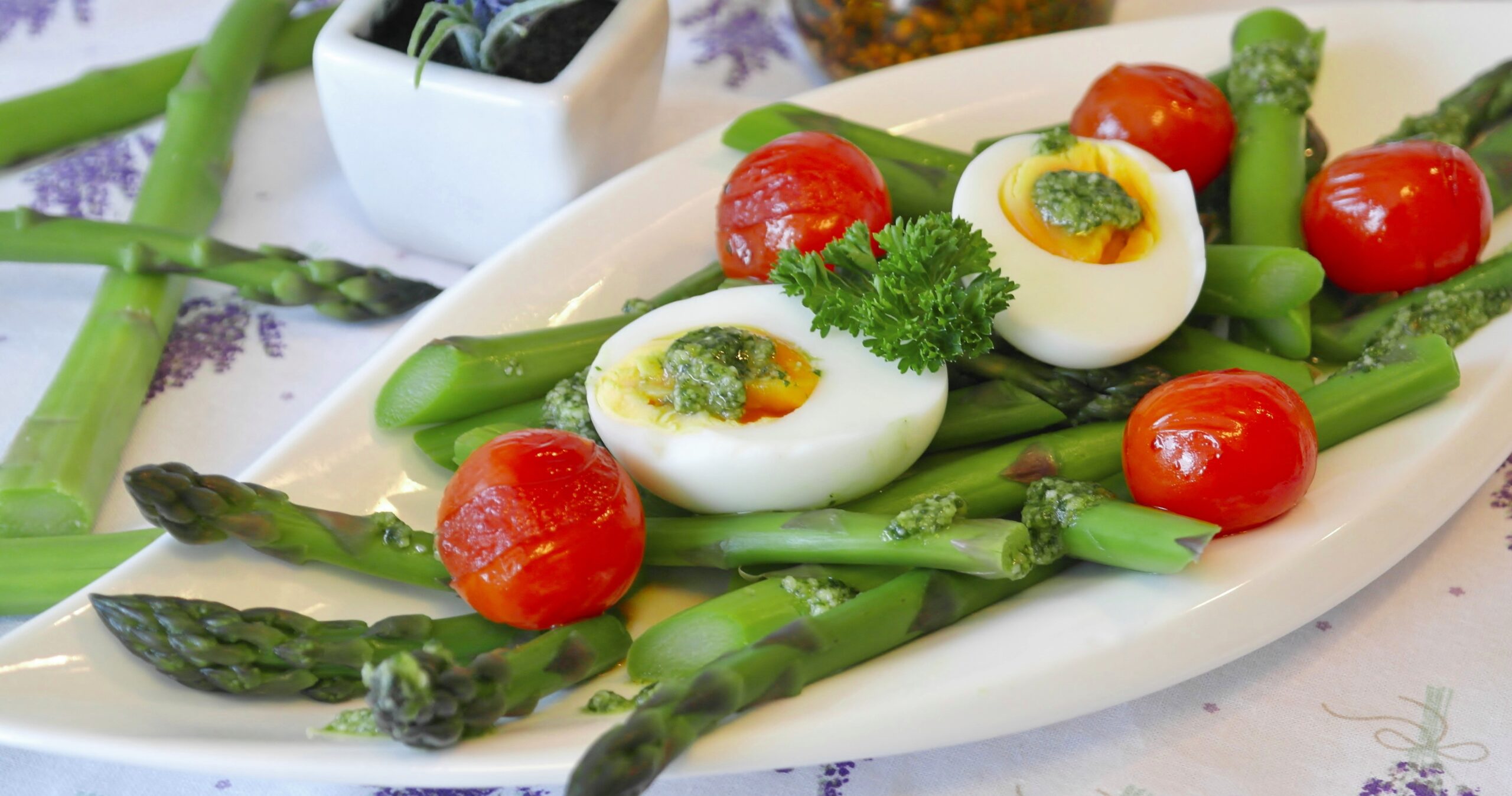 Low carb dieting foods like chicken, eggs, salad greens, and avocado on a plate for a realistic low carb weight loss plan in 2026.
